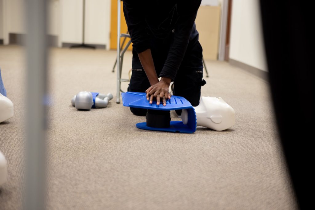 person performing CPR on a dummy. CPR facts you should know.